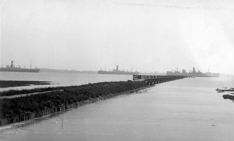 Laid up ships off Tollesbury Pier, c1932. HIGHLAND WARRIOR is at the end of the pier. Part of a postcard, 126359. Date: c1932.